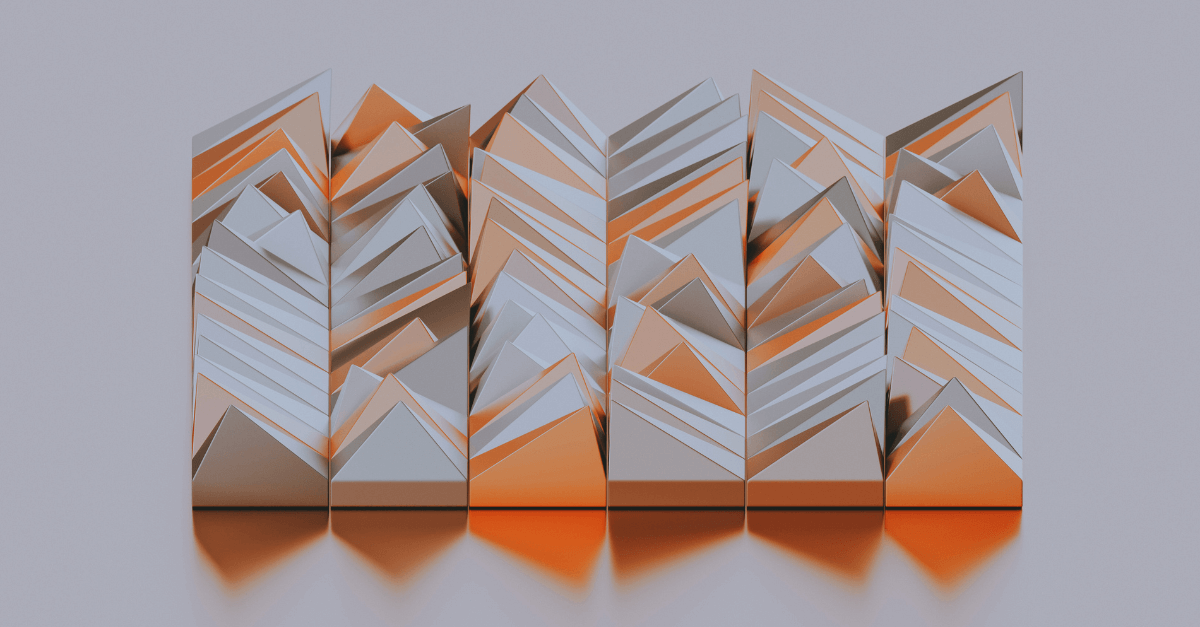 Abstract geometric sculptures, arranged in a line, feature sharp angular shapes with alternating patterns of orange and gray hues. They create a mountain-like appearance in a minimalist setting.